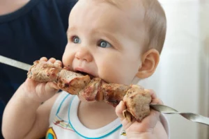 baby-eating-meat-kebob